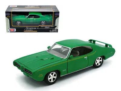 MOTORMAX 1969 PONTIAC GTO JUDGE GREEN WITH STRIPES 1/24 DIECAST MODEL CAR BY MOTORMAX