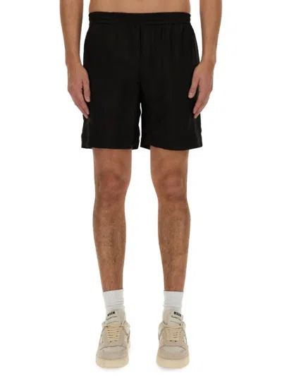 MSGM BLACK SHORTS WITH SUBTLE LOGO DETAIL