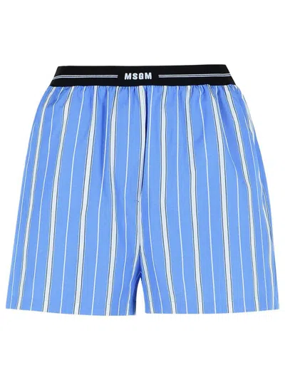 MSGM BLUE BERMUDA SHORTS WITH ELASTIC DRAWSTRING WAIST WITH LOGO LETTERING AND ALL-OVER STRIPED MOTIF IN 