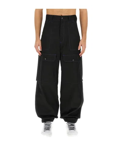 Msgm Contrasting-stitch Logo-patch Trousers In Black