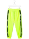 Msgm Logo Tape Track Pants In Yellow
