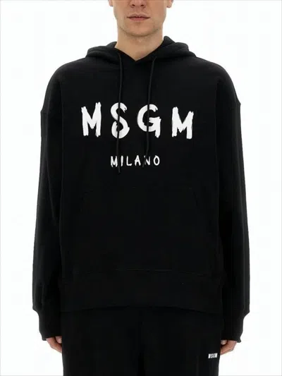 Msgm Relaxed Fit Hoodie With Bold Brushstroke Lettering In Black