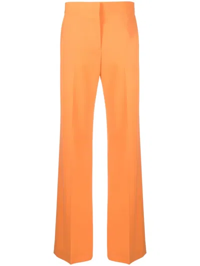 Msgm Pleated Wide-leg Trousers In Stretch Wool Twill In Orange