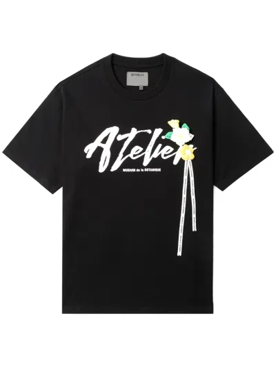 Musium Div. Graphic-print Cotton T-shirt In Black