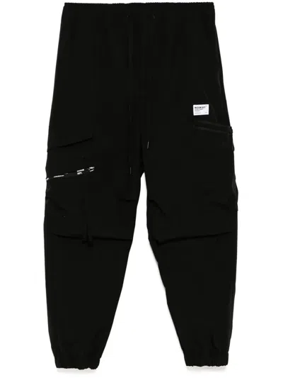 Musium Div. Logo-patch Trousers In Schwarz