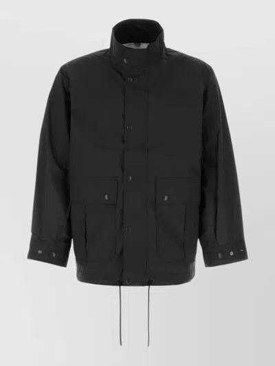 Nanamica Nylon Windbreaker Coat Drawstring Hem Pockets In Black