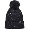 Nanette Lepore Scattered Rhinestone Beanie With Faux Fur Pompom In Black