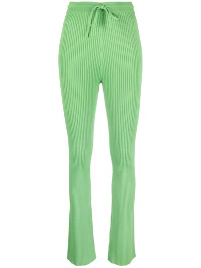NANUSHKA CORNELIE RIBBED-KNIT FLARED TROUSERS