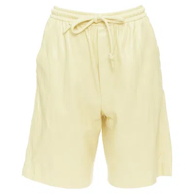 Nanushka Munira Okobor Vegan Leather Drawstring Bermuda Shorts In Yellow
