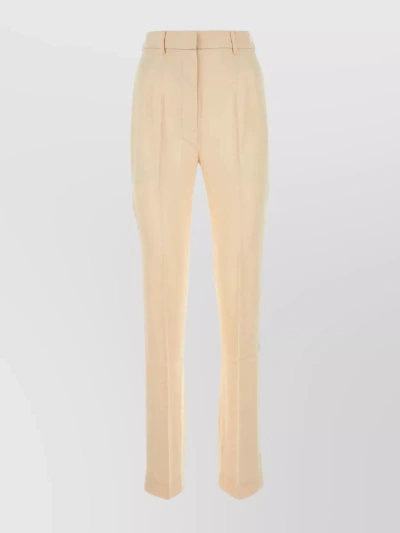 Nanushka Felina Alt-leather Button Side Pants In Cream