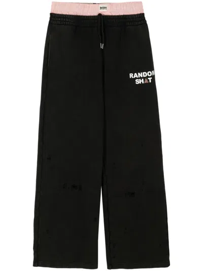 Natasha Zinko Layered Logo-print Trousers In Black