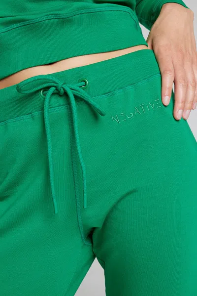 Negative Club Jogger In Field In Green