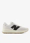 New Balance 370 Low-top Sneakers In Sea Salt With Black Cement In Neutral