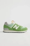 NEW BALANCE 574 SNEAKER IN DARK GREEN AT URBAN OUTFITTERS