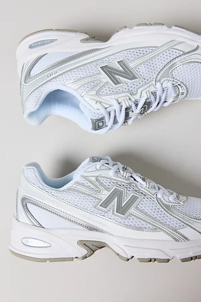 NEW BALANCE WOMEN'S 740 SNEAKER IN WHITE WITH SILVER METALLIC AND REFLECTION AT URBAN OUTFITTERS
