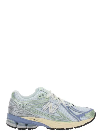 NEW BALANCE BLUE LOW TOP SNEAKER WITH LOGO PATCH ON TONGUE AND SIDE AND PERFORATED PANELS IN TECH FABRIC UNISEX