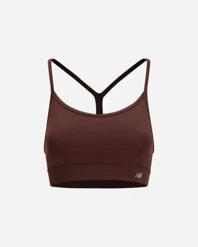 New Balance Essential Yoga Sports Bra In Bordeaux