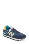 New Balance Gender Inclusive 574 Rugged Sneaker In Blue Navy/yellow