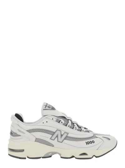 NEW BALANCE GREY LOW TOP SNEAKERS WITH LOGO PATCH ON SIDE AND TONGUE AND PERFORATED PANELS IN TECH FABRIC UNISEX