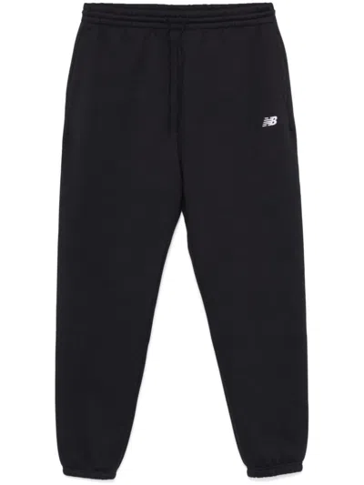 New Balance Logo-embroidered Track Pants In Black