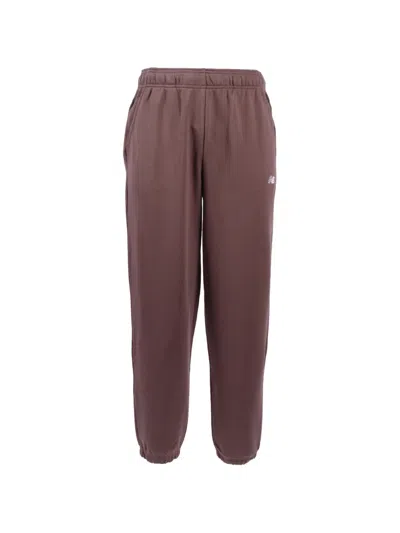 New Balance Logo Track Pants In Brown