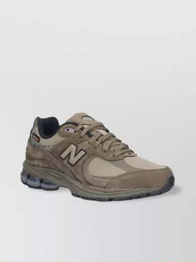 NEW BALANCE LOW TOP SNEAKERS WITH MESH PANELS AND RUBBER OUTSOLE