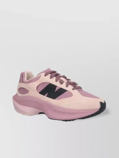 NEW BALANCE LOW TOP SNEAKERS WITH RUBBER OUTSOLE AND TEXTURED PANELS