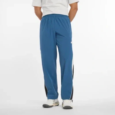 New Balance Men's In Game Woven Track Pant In Blue