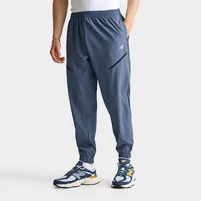 New Balance Men's Woven Zip Pocket Jogger Pants In Blue