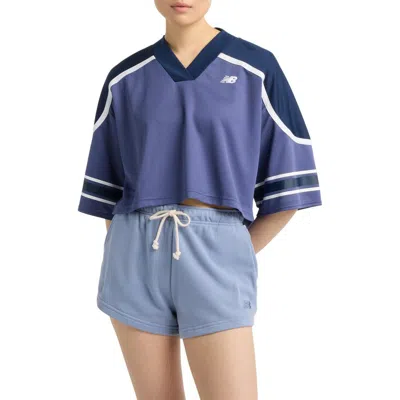 NEW BALANCE NEW BALANCE OVERSIZE CROP JERSEY MESH V-NECK T-SHIRT