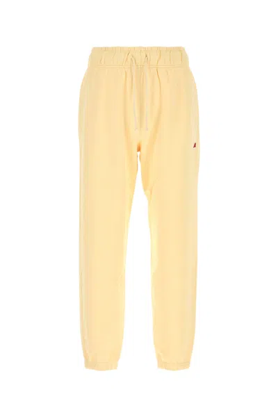 NEW BALANCE PANTALONE JOGGING IN COTONE GIALLO PASTELLO UOMO