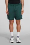 NEW BALANCE SHORTS IN GREEN POLYESTER