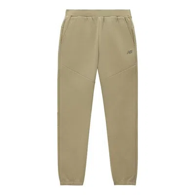 New Balance Sport Woven Pants 'khaki' In Brown