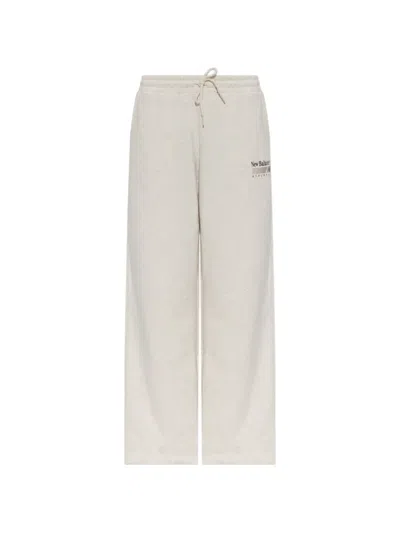 New Balance Trackside Logo-print Drawstring Track Pants In Neutral