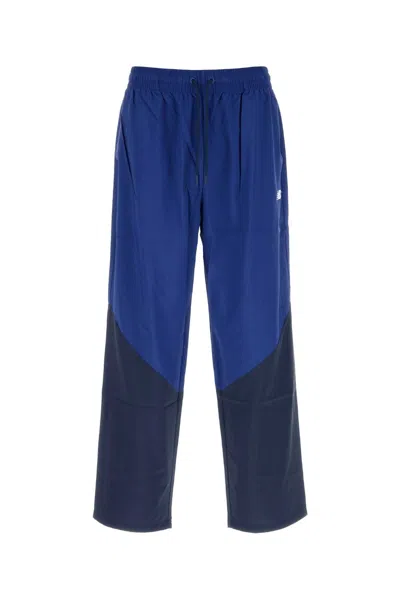 New Balance Two Tone Nylon Joggers In Blue