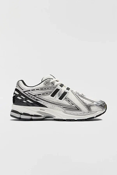 NEW BALANCE UNISEX 1906R SNEAKER IN SILVER METALLIC/BLACK AT URBAN OUTFITTERS