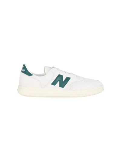 New Balance Unisex Suede Court Sneaker In White
