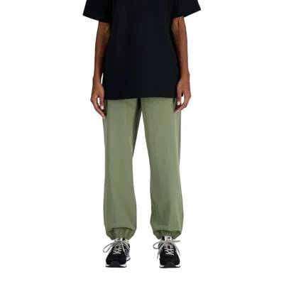 New Balance Women's Athletics Stretch Woven Jogger Pants In Dark Olvine Green