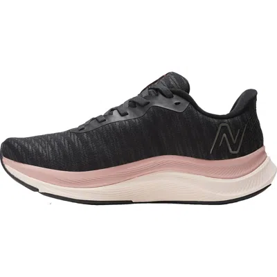 New Balance Women's Fuelcell Propel V4 Running Shoe - Medium Width In Black/quartz Pink/pink Moon In Multi