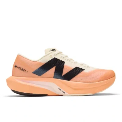 New Balance Women's Fuelcell Rebel V4 In Orange/beige/black