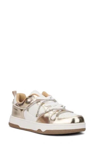 New York And Company Fable Metallic Sneaker In Gold