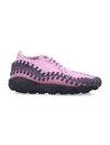 Nike Woven Footscape Sneakers Featuring Asymmetrical Lacing In Pink