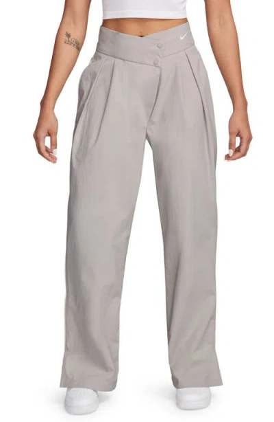Nike Asymmetric Waist Water Repellent Pants In Light Iron Ore/ Brown/ White