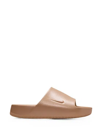 Nike Calm Logo-debossed Slides In Gold