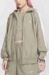 Nike Women's  Sportswear Classic Wovens Loose Uv Hooded Jacket In Light Army/ White