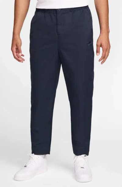 Nike Club Taper Woven Pants In Obsidian
