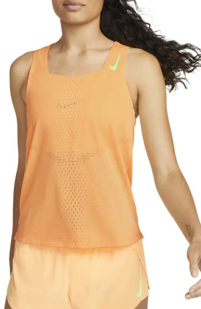 Nike Dri-fit Adv Aeroswift Racing Singlet In Peach Cream/ghost Green
