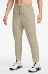 Nike Dri-fit Unlimited Drawstring Pants In Brown
