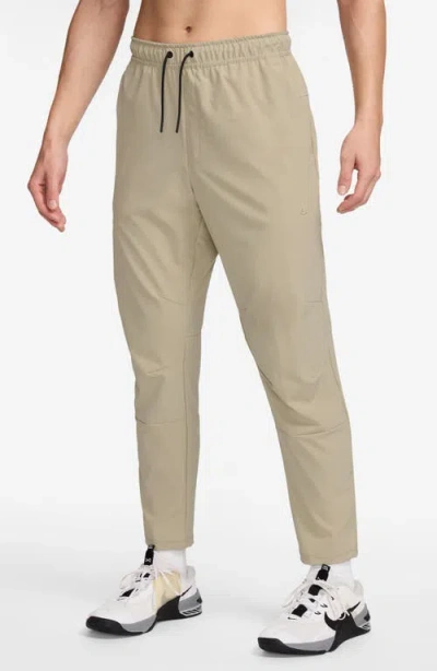 Nike Dri-fit Unlimited Drawstring Pants In Brown