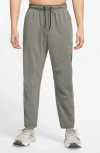 Nike Dri-fit Unlimited Drawstring Pants In Gold